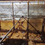 Sediment buildup contributing to tank corrosion